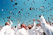 Newly commissioned officers celebrate their new positions by throwing their midshipmen covers into the air as part of a U.S. Naval Academy graduation and commissioning ceremony. US Navy 020524-N-1026B-013 Throw of hats into the air.jpg