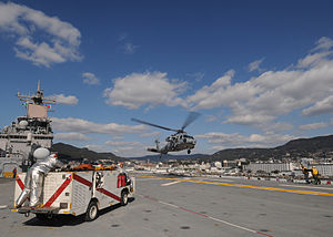 US Navy 120126-N-SO729-023 An MH-60S Sea Hawk helicopter assigned to Helicopter Sea Combat Squadron (HSC) 25 lands on the flight deck of the forwar.jpg