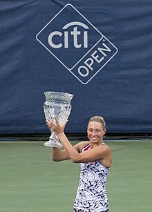 Wickmayer holding the trophy after winning the 2016 Washington Open, her fifth WTA title 2016 Citi Open Yanina Wickmayer (28244377380).jpg