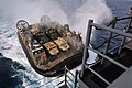 A U.S. Navy Landing Craft Air Cushion, more commonly known as an LCAC, approaches the well deck of the amphibious assault ship USS Bonhomme Richard (LHD 6) as the ship operates in the East China Sea on Feb 130202-N-VA915-096.jpg