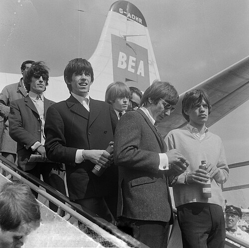 The Rolling Stones arriving at Amsterdam Airport Schiphol, Netherlands, in 1964. From left to right: Wyman, Richards, Jones, Watts and Jagger