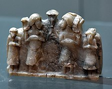 Alabaster group of snake-god and worshipers from Tell Asmar, Iraq. 2600-2370 BCE. Iraq Museum.jpg