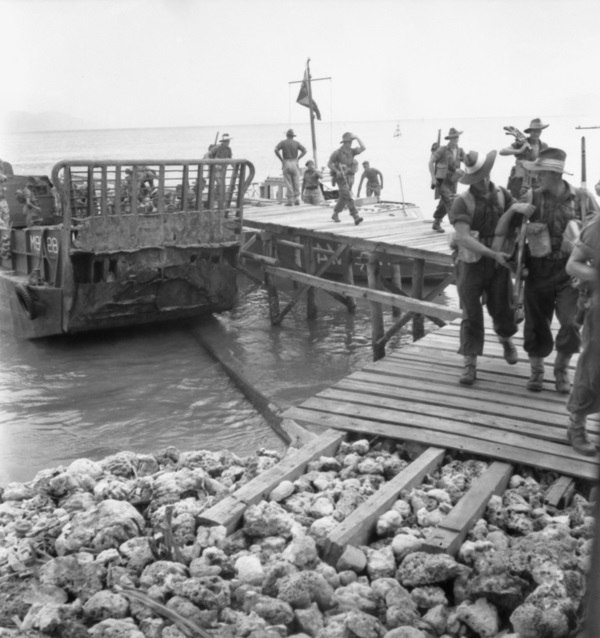 Troops from 'D' Company, 2/32nd Battalion coming ashore at Jesselton, September 1945