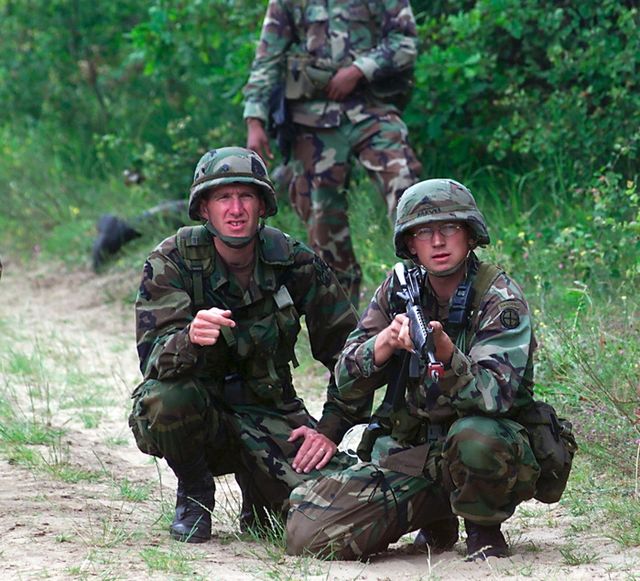 U.S. Army National Guardsmen on an exercise in 2000 while wearing Woodland BDUs and PASGT helmets