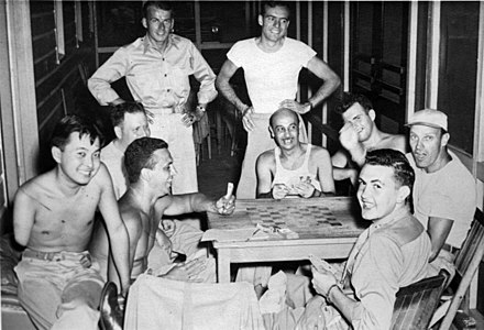Friend and future senator Daniel Inouye (left) with Dole (next to Inouye) playing cards while recovering at Percy Jones Army Hospital in the mid-1940s.