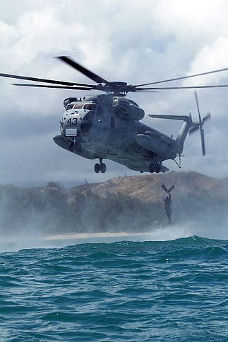 A United States Marine jumping from a CH-53D Sea Stallion during a helocast off the coast of Hawaii. CH53E-Helo-Cast.jpg