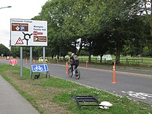 COVID-19 pop-up cycle lane in Chichester, England, August 2020 Chichester-Ave-De-Chartes-Covid-19-Pop-up-Cyclelane-20200824-with-cyclist.jpg