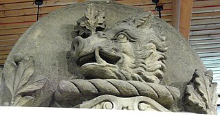 Victorian carved sandstone lintel featuring a boar's head and oak leaves as a heraldic crest, from Keighley area.
