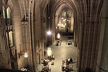 The 52 ft (16 m) high, half acre (2,000 m ) Commons Room of the Cathedral of Learning serves as a major study and event space for the university and its students. CoLCommonsRoomUPitt.jpg