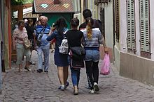 Two pickpockets attempting to rob a Japanese tourist couple in Colmar, France. The tourists were alerted before the theft could be completed. Colmar-PV-Pickpockets.jpg