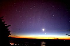 The tail of the comet Comet McNaught was still seen in the Northern hemisphere after the comet itself was long gone. The picture also shows the Moon and Venus.
