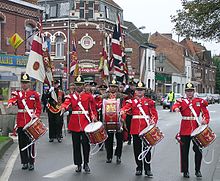 A corps of drums of the Duke of Wellington's regiment (since amalgamated into the Yorkshire Regiment). DWR Colours, Erquinghem Lys, France (RLH) 2005-11-12.JPG