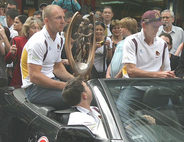Darren Lockyer and Wayne Bennett parade the premiership after the Brisbane Broncos' Grand Final victory in 2006.