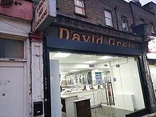 David Greig shop sign. David Greig shop sign at 257 Old Kent Road, London. Photo taken in November 2019.jpg