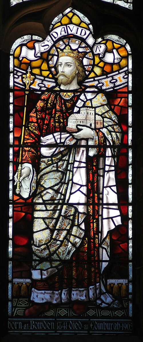 David I holds a speculative model of the first St Giles' in a 20th-century window.