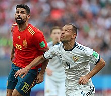 Costa and Russia's Sergei Ignashevich at the 2018 FIFA World Cup