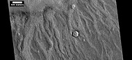 Channels made by the backwash from tsunamis, as seen by HiRISE tsunamis were probably caused by asteroids striking the ocean.