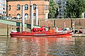 Deutsch: Feuerlöschboot Feuerwehr IV am Anleger Kehrwiederspitze in Hamburg-HafenCity. This is a photograph of an architectural monument. It is on the list of cultural monuments of Hamburg, no. 29049.