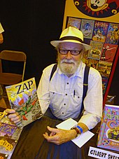 kleurenfoto van Gilbert Shelton met daarop een stripverhaal met zijn creatie Wonder Wart-Hog op de omslag