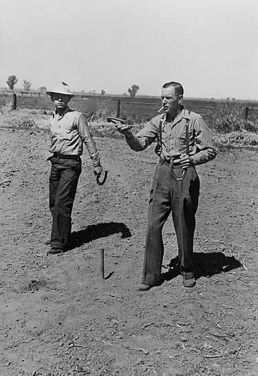 Horseshoe pitching contest at the annual field day of the FSA farmworkers community, Yuma, Arizona (1942) Horseshoes2.jpg