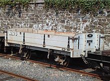 Restored drop-side wagon M.78 in a siding at Douglas Station; this was restored by the Association Mainland Group in 1998 and remains in regular use on photographic charters and mixed trains during events, when not displayed in the Isle of Man Railway Museum IMR-M78-Wagon.jpg