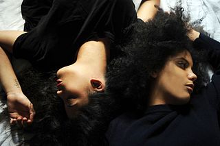 Ibeyi is an Afro-French Cuban musical duo consisting of twin sisters Lisa-Kaindé Diaz and Naomi Diaz. The duo sings in English, French, Spanish and Yoruba, a Nigerian language spoken in West Africa by their ancestors before being taken to Cuba as slaves in the 1700s. In Yoruba, Ibeyi (Ìbejì) means 