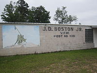 The VFW post is named for James D. Boston Jr. (1916-1986), a World War II prisoner of war and later a history teacher at Montgomery High School. J.D. Boston VFW Post, Montgomery, LA IMG 2440.JPG