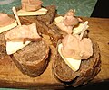 Small open sandwiches. Bread, butter and codfish liver paste.
