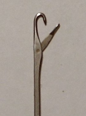 A latch hook for rugmaking.