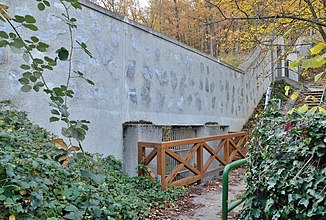 Barred passage for the Veitlissengraben in the wall of the Lainzer zoo