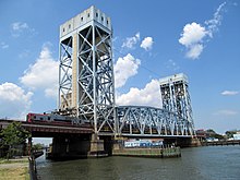 A New Haven Line train of M8 cars on the Park Avenue Bridge in July, 2014 M8s on Park Avenue lift bridge, July 2014.JPG