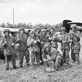 Members of 12th Parachute Battalion, 5th Parachute Brigade, 6th Airborne Division, enjoy a cup of tea after fighting their way back to their own lines after three days behind enemy lines in Normandy, 10 June 19 B5349.jpg
