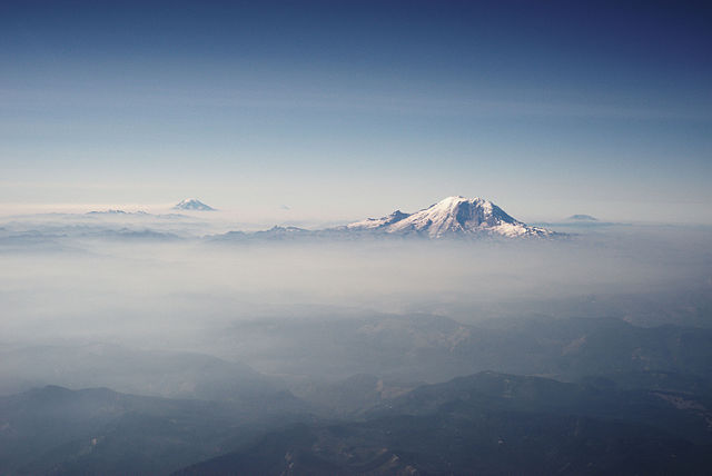 The Cascades in Washington, with Mount Rainier, the range's highest mountain, standing at 14,411 ft (4,392 m). Seen in the background (left to right) 