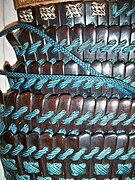 Close up view of Japanese lamellar armour, constructed with small individual scales/lamellae known as kozane