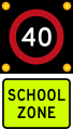 (R1-6) 40 km/h school zone speed limit in effect when flashing