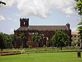 The Basilica of Bom Jesus, amidst greens, as seen from the streets of old Goa.
