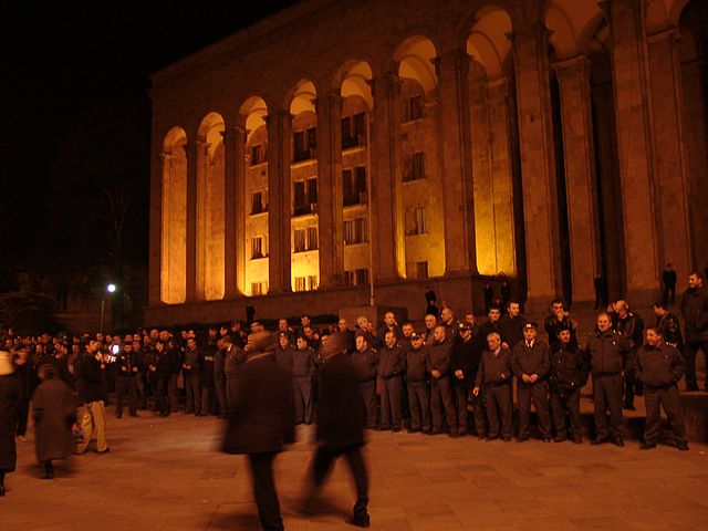 Protesters standing in front of the Georgian Parliament Building during the Rose Revolution