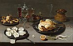 Thumbnail for File:Osias Beert (I) - Still life with oysters, roasted chicken, sweets and dried fruits.jpg