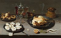 Still life with oysters, roasted chicken, sweets and dried fruitsStill life with oysters, roasted chicken, sweets and dried fruits