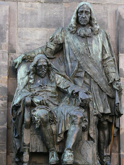 Standbeeld van de gebroeders De Witt (Johan zittend en Cornelis staand) van de hand van Toon Dupuis uit 1918 bij de Visbrug in Dordrecht.