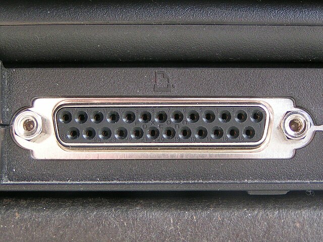 A DB-25 connector often used for a parallel printer port on IBM PC compatible computers, with the printer icon.