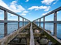 * Nomination Partially dismantled pier in Eckernförde --MB-one 11:16, 14 April 2020 (UTC) * Promotion Possible FP for a great composition. Is it tilted CW a bit? Both the left and right vertical posts are leaning right, but since we can't see the horizon I'm not sure if that is the result of a tilt or if the bridge is actually leaning that way.--Peulle 12:49, 14 April 2020 (UTC) @Peulle: Thank you for the kind review. The answer is probably both. I assumed the far poles and plank to be perfectly leveled, but after careful inspection, that doesn't seem to be the case. Uploaded a new version. --MB-one 11:23, 15 April 2020 (UTC) I guess only a real-life inspection will give an answer. Nothing on this pier is straight. xD --Peulle 18:03, 15 April 2020 (UTC)