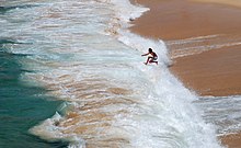 Playing in the surf is a popular recreational activity. Porto Covo July 2011-1.jpg