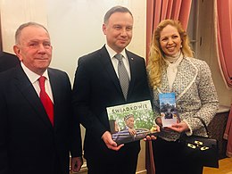 President of Poland Andrzej Duda (centre) and Aharon Tamir-March of the Living Deputy Chairman (left) with copy of Witness President of Poland Andrzej Duda with Aharon Tamir-March of the Living.jpg