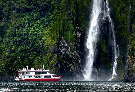 Pride of Milford cruise next to Stirling Falls in New Zealand.