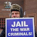 Protester outside Belmarsh Prison with placard 'Jail the War Criminals !'.jpg