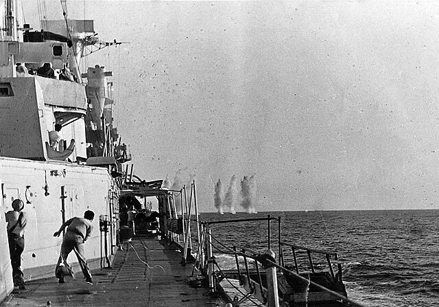 Italian sailors watch British shells land near their ship in the Battle of Calabria