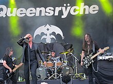 Queensrÿche performing at the Sauna Open Air Metal Festival in Finland, June 2011. From left to right: Eddie Jackson, Geoff Tate, Scott Rockenfield, Michael Wilton.