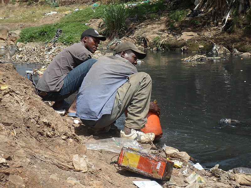 File:Rinsing the equipment without any soap or protective gloves (6829310730).jpg