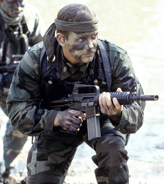 U.S. Navy SEAL with Colt Commando. Note: large flash suppressor